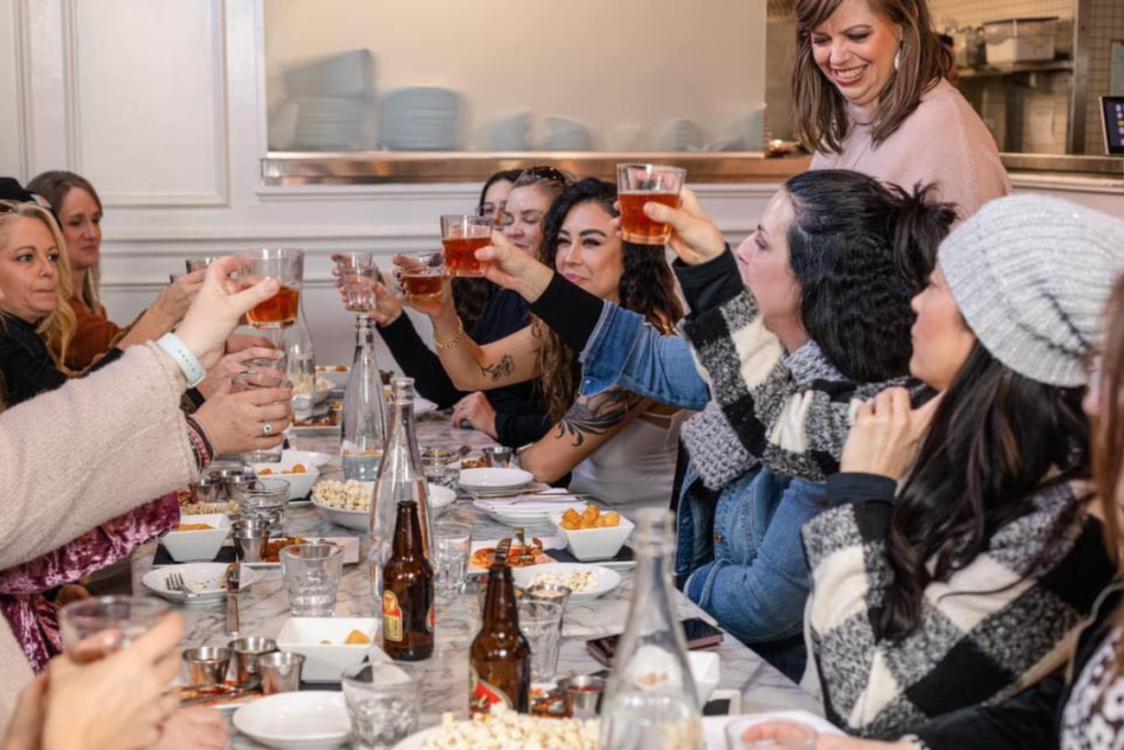birthday party toasting their drinks on a nashville food tour