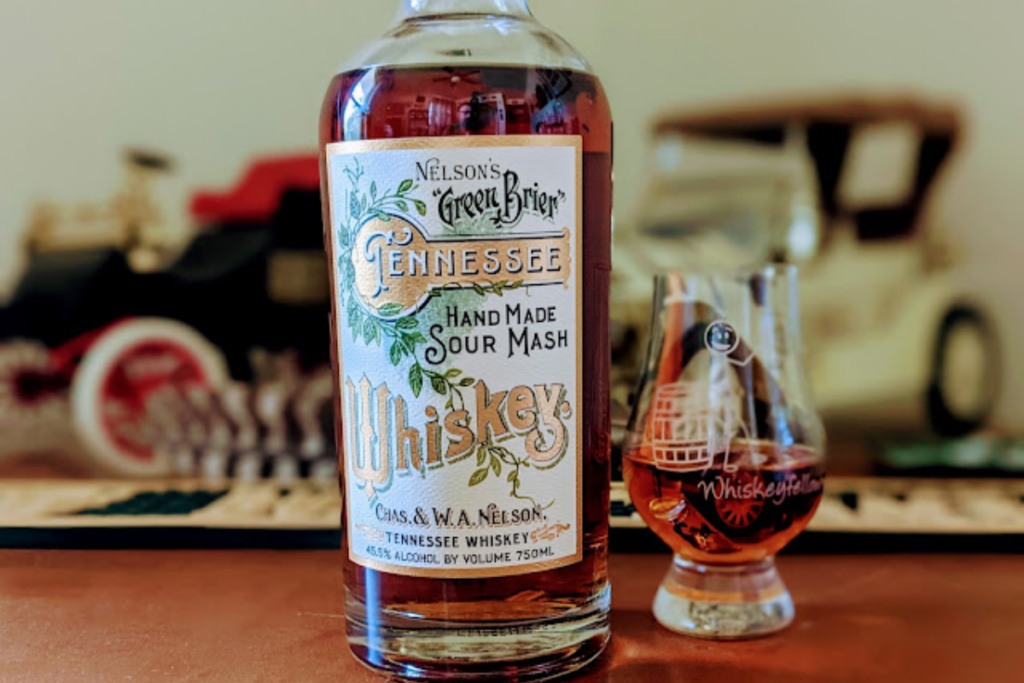 bottle of whiskey from nelson's green brier distillery with a tasting glass next to it
